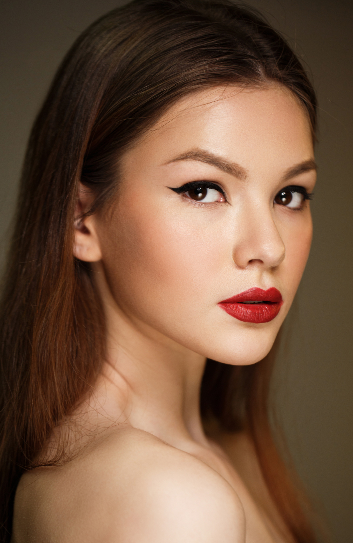 woman with red lips and black eyeliner